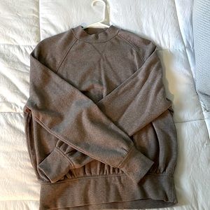 Long sleeve sweater in a purply brown color. Brand is “Universal Thread”.